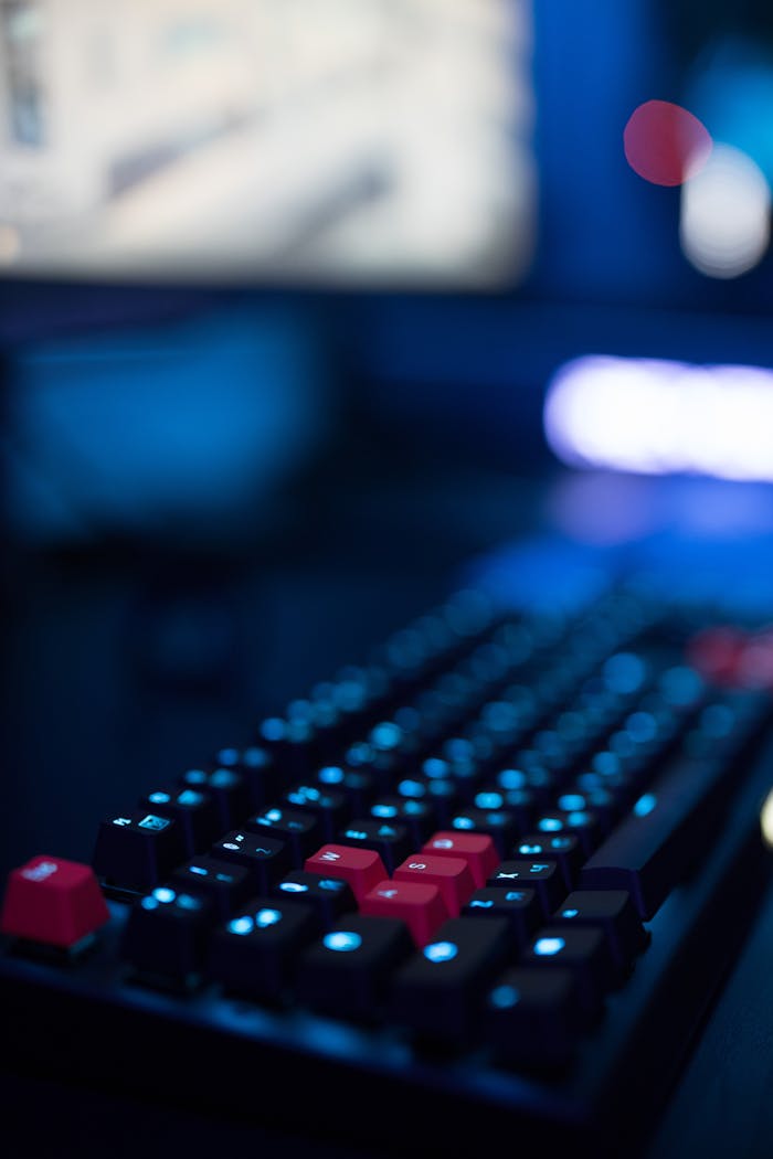 brand-01 A focused shot of a gaming keyboard with illuminated keys, showcasing modern tech design.